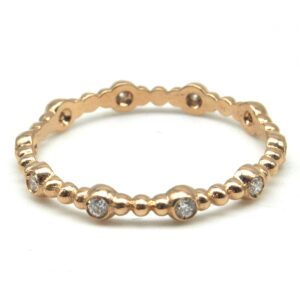 Ball ring in red gold and diamonds