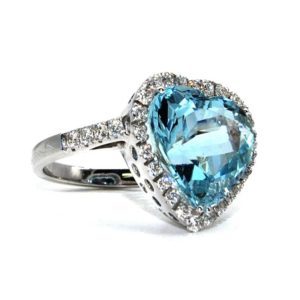Ring in white gold, brilliant-cut diamonds and heart-cut blue aquamarine.