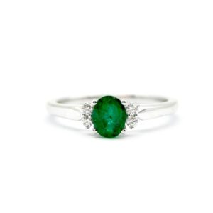 Oval cut emerald and diamond ring
